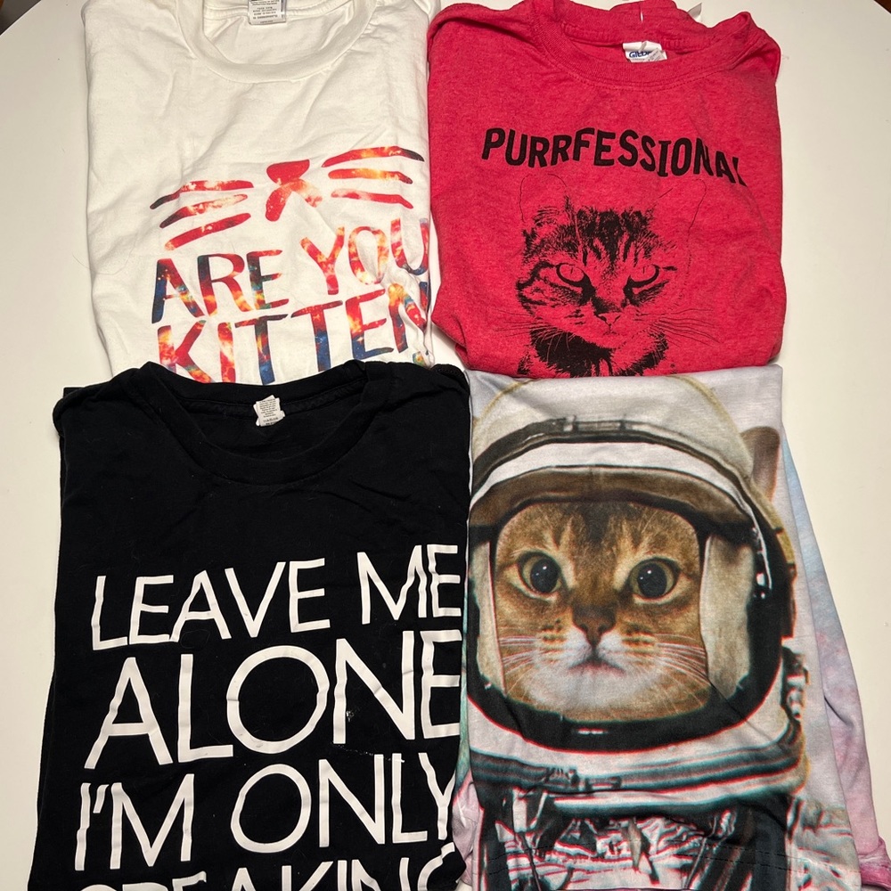 Bundle of four cat-themed t-shirts size medium and large